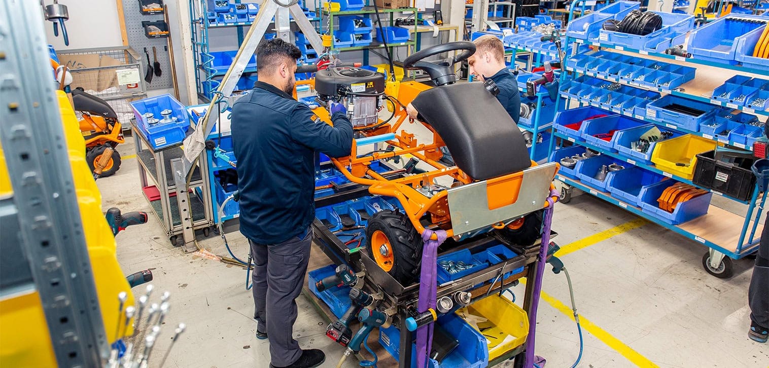 AS-Motor factory assembly line, showcasing the assembling of a AS Sherpa with two workers