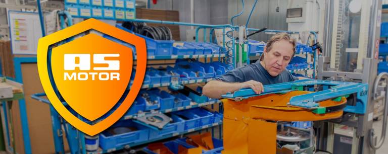 AS-Motor warranty highlight, showcasing the craftsmanship inside the AS-Motor factory. A man is torquing down the main bolt for the mower blade