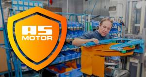 AS-Motor warranty highlight, showcasing the craftsmanship inside the AS-Motor factory. A man is torquing down the main bolt for the mower blade